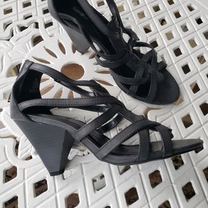 Gunmetal grey strapy shoes.